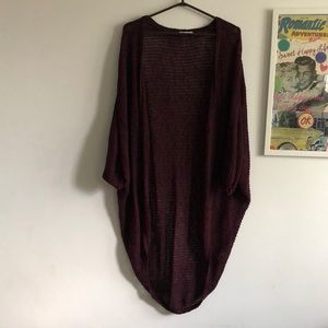 Purple mid-length cardigan.